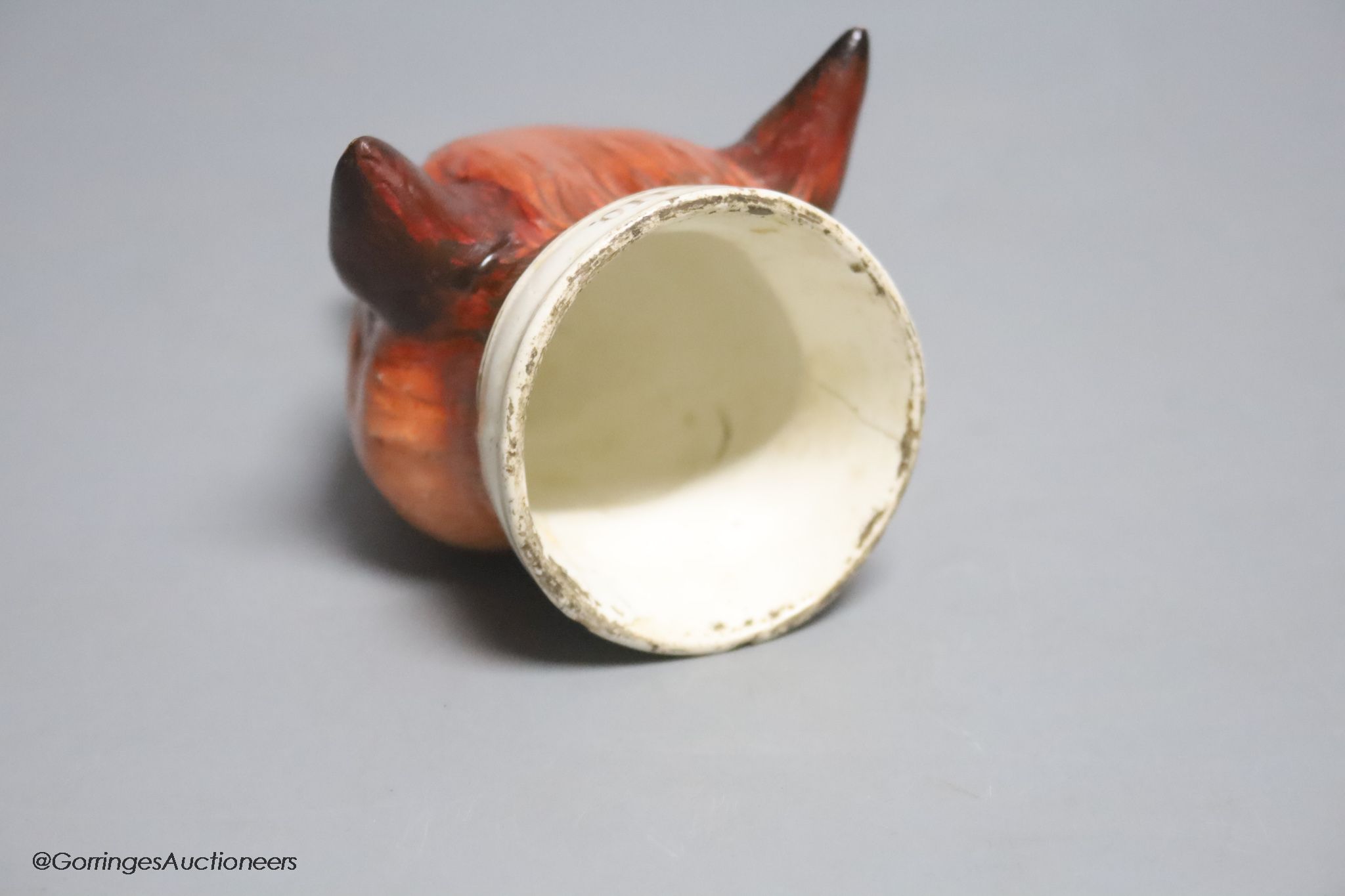 An early 19th century English porcelain 'Tally Ho' fox head stirrup cup, length 11cm